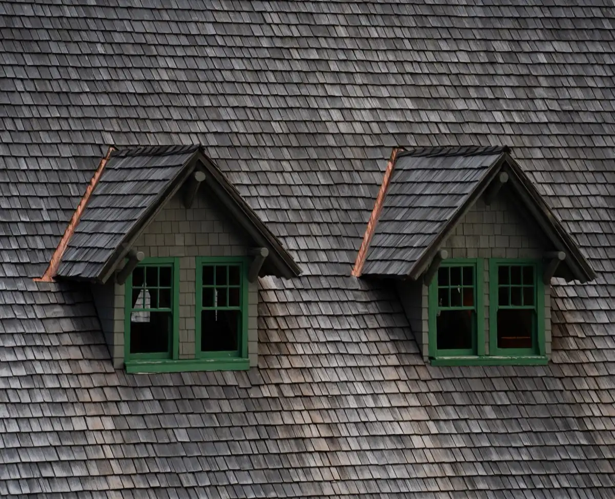 Dormers on a shingle roof in Springfield, MA, where step flashing and kickout flashing carry water past the walls